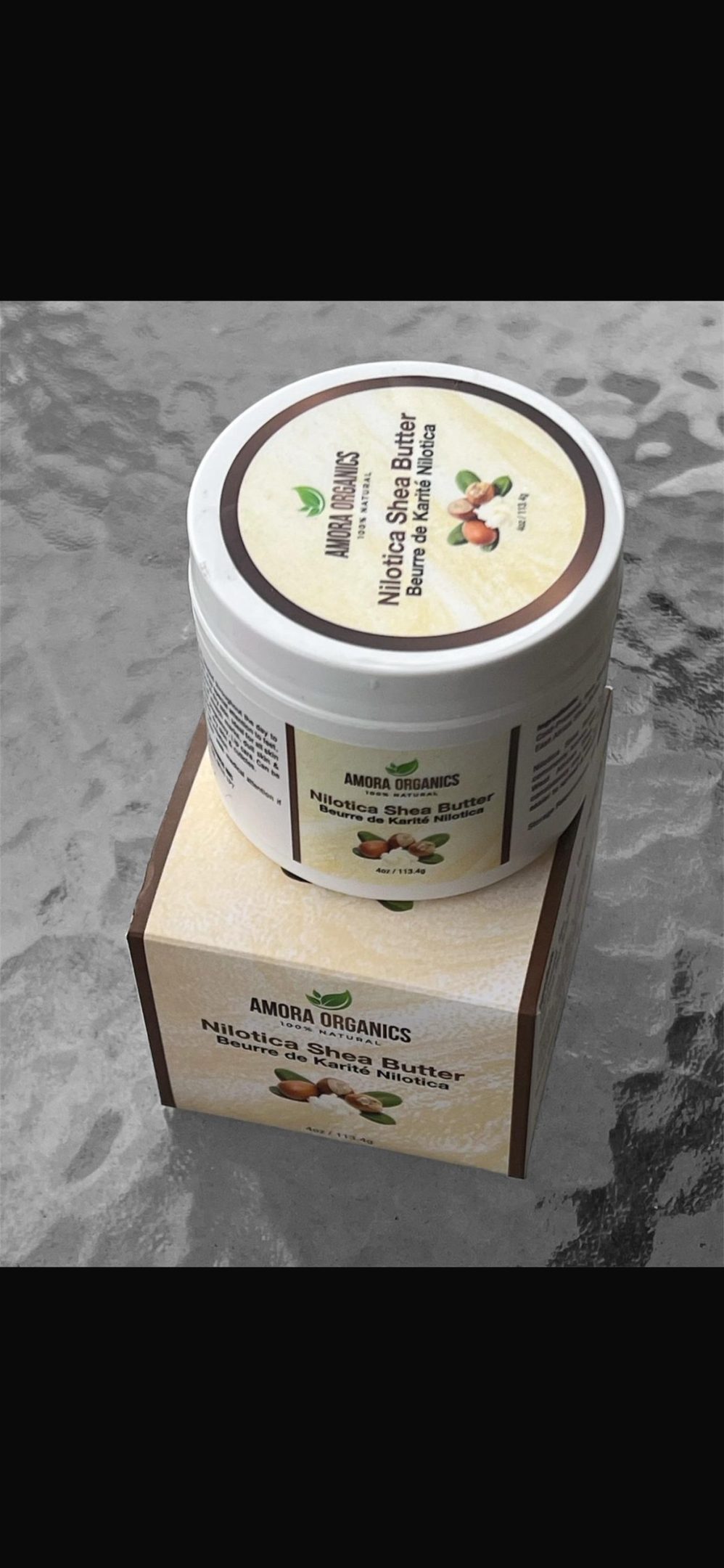 Herbal skincare cream with natural ingredients in a jar and box.